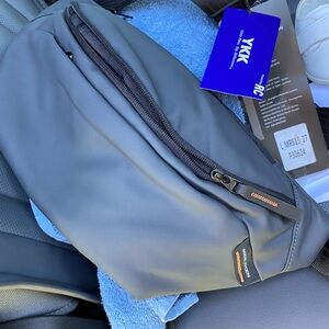 Stylish sling pouchMR615 with Racquet Coil Design